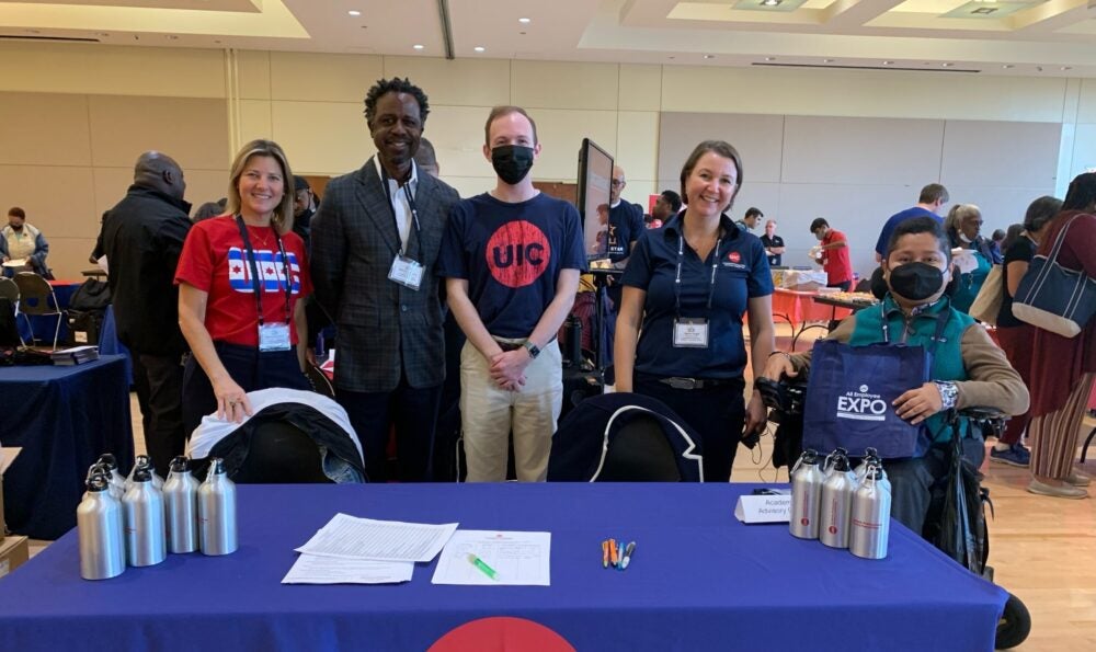 Four Committee members and Graduate Assistant attending the Fall 2022 UIC All Employee EXPO